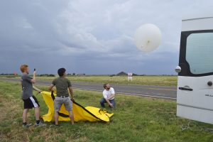 Scientist Dr. Eric Bruning conducting weather research for exhibition.